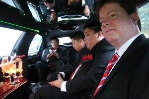 grooms men on their wedding limo service