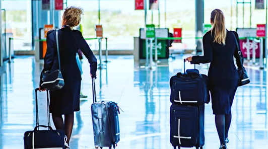 two stewardesses heading limo service for airline crew