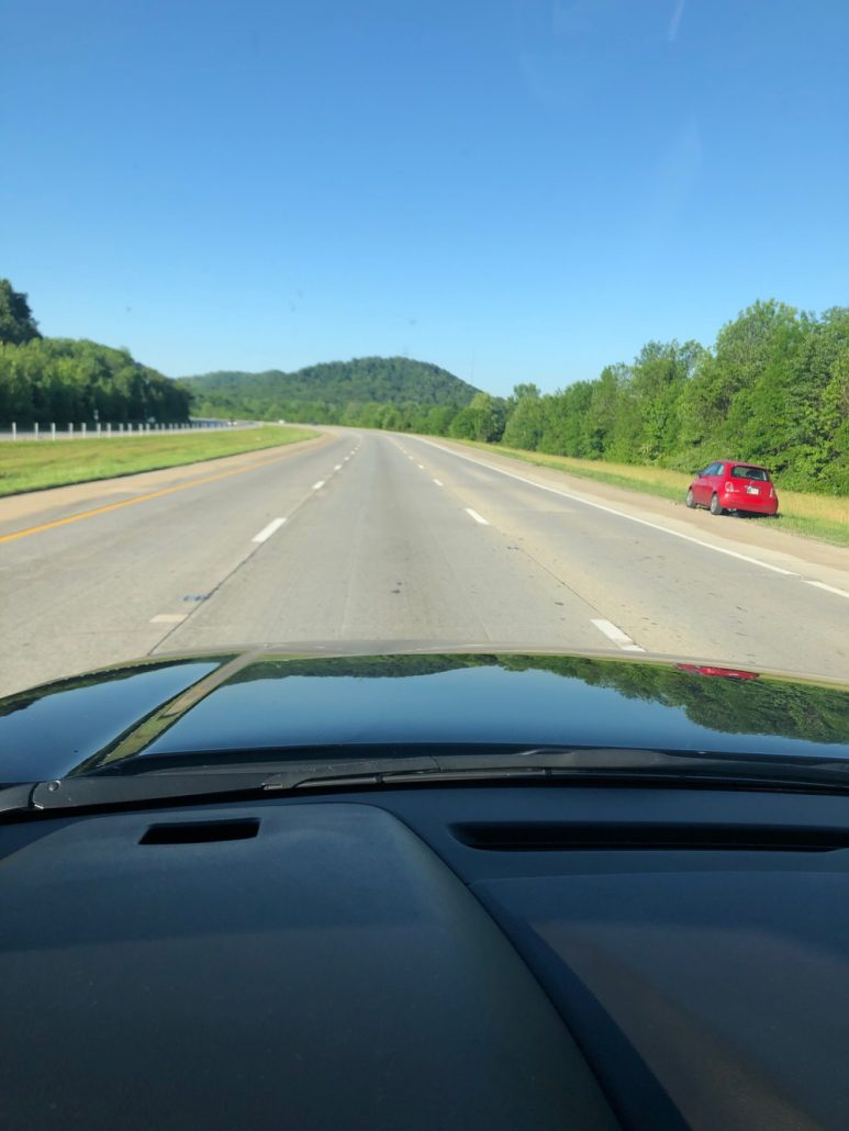 a front picture of a limo car service on the road travelling from chicago to atlanta