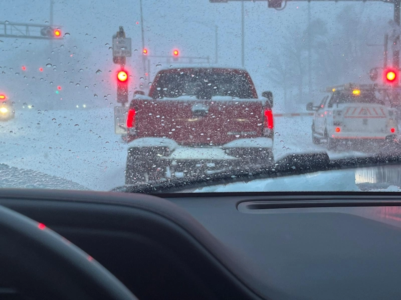 a car driving through a snowy road